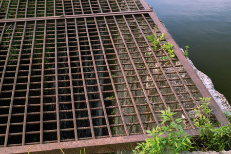 Photograph depicting lake pollution due to sewage discharge, emphasizing environmental regulations...