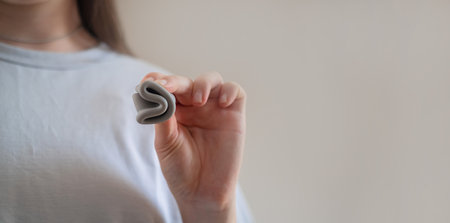 Using a menstrual cup during menstruation, with women's health products including vitamins and...