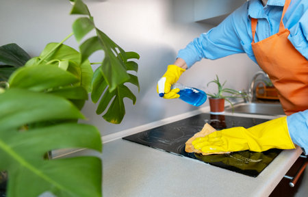 Many cleaning products are specifically designed to tackle tough stains like grease, limescale, or burnt food residue.の写真素材