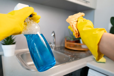 Moment of cleanliness: woman doing a deep clean, removing dust and dirt from every corner of her home.の写真素材
