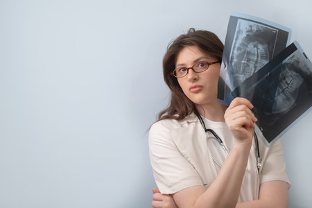 Dentist conducts a thorough examination, comparing X-rays to detect hidden dental issues and...