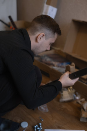 Home handyman assembling fitness equipment for effective workouts without leaving the house.