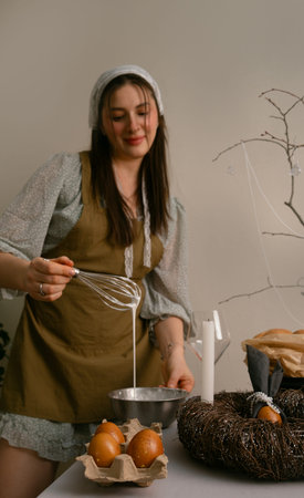 Family Easter traditions, woman preparing icing for Easter cake in a warm and cozy home kitchen...