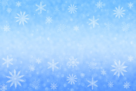 Defocus blue background with bokeh and snowflakes. Christmas, New Year. Copy space.の写真素材