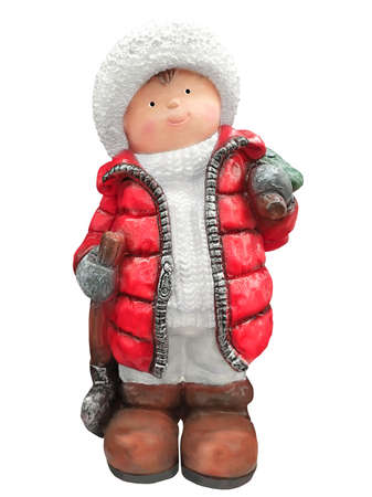 A toy figure of a boy in a red jacket with a Christmas tree and an ax. The toy is isolated on a white background.の写真素材