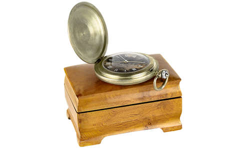 Vintage pocket watch with a lid on a wooden jewelry box. isolated on a white background.の写真素材