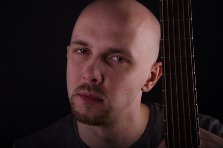 Nice bald guy with a guitarの写真素材