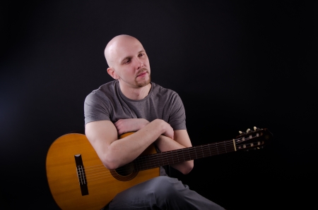 Nice bald guy with a guitarの写真素材