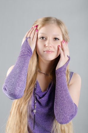 Beautiful young girl in a lavender dressの写真素材