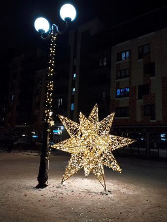 Christmas star on the street at night in Moscow, Russia. Festive decoration.の写真素材