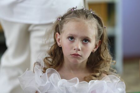 Belarus, the city of Gomel,Graduation in kindergarten  06/03/2016.Sad little girl .Tired expression.Emotion of sadness and sadness in a childのeditorial素材