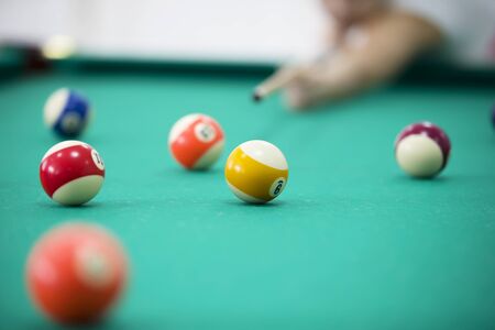 Billiard balls on a green background. Billiards gameの写真素材
