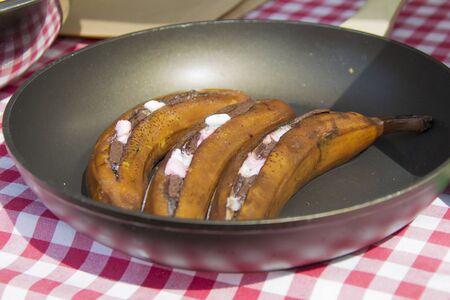 Fried bananas in a skillet. Unusual fruit dishesの写真素材