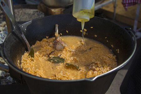 Rice in a cauldron with garlic. Pilaf. Cookingの写真素材