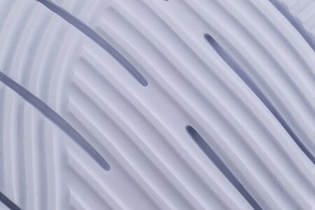 Fragment of a rubber white sole of a sneaker. Bottom of sports shoes