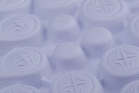 Fragment of a rubber white sole of a sneaker. Bottom of sports shoes