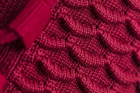 Fragment of red sneaker fabric. The texture of the material of sports shoesの写真素材