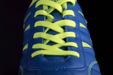 Texture of a blue sneaker closeup. Part of leather sports shoesの写真素材