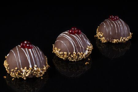 Small chocolate cakes on a black background.Brownieの写真素材
