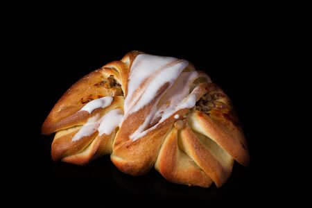 Bun with nuts on a dark backgroundの写真素材