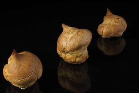 Cake profitroles close-up on a dark backgroundの写真素材