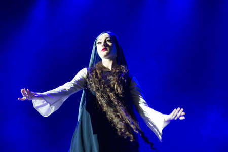 Belarus, Gomel, February 27, 2018. Concert hall. Speech of the national Georgian ballet Sukhishvili.A Georgian woman in a national white costume dances Georgian danceのeditorial素材