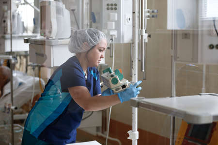 Belarus, the city of Gomel.City burn hospital,June 1, 2017.Nurse in resuscitation sets up devices.The nurse prepares the operating roomのeditorial素材