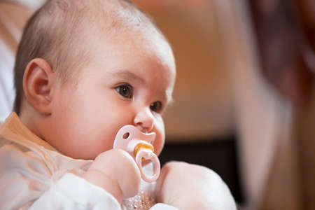 Belarus, the city of Gomel. June 10, 2017. Church at the regional hospital. Portrait of a little girl at the rite of baptism.Baby with pacifierのeditorial素材