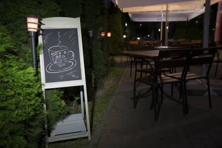 Blackboard on the background of the bar. Empty menu in the evening restaurantの写真素材