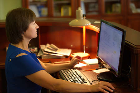 Belarus, Gomel, September 19, 2017. The woman works at the computer. Working in the officeのeditorial素材