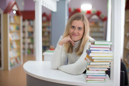 Belarus, Gomel, November 15, 201. The main library. The library worker. Librarian. Issue books.のeditorial素材