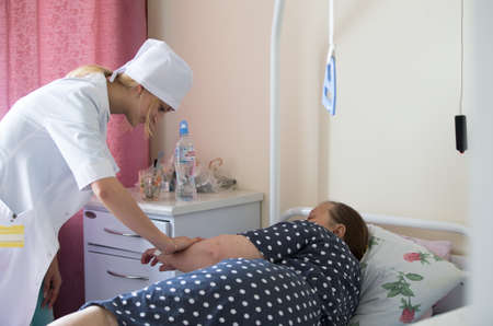 Belarus, Gomel, May 31, 2017. Gomel central hospital.A nurse cares for a patientのeditorial素材