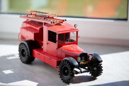 Toy retro fire truck of red color.の写真素材