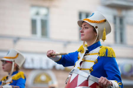 Belarus, Gomel, September 16, 2017. Celebrating the city day.A drummer woman walks down the street with a drum. The drummer from the city orchestraのeditorial素材