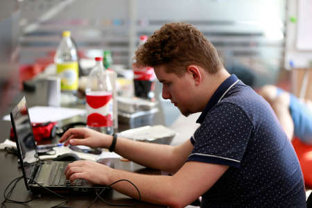 Belarus Minsk 06 August 2016 The Park of High Technologies. Competitions programmers.A young man is working at the computer.Work of the programmer.のeditorial素材