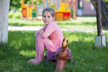 Belarus, the city of Gomil, April 26, 2019. Kindergarten on the street.Six year old girl on a summer walk.のeditorial素材