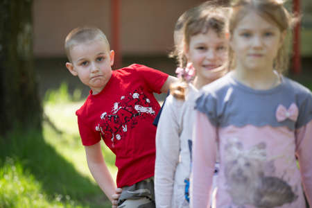 Belarus, the city of Gomil, April 26, 2019. Kindergarten on the street.A boy from kindergarten on a summer walk on the background of blurry childrenのeditorial素材