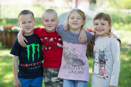 Belarus, the city of Gomil, April 26, 2019. Kindergarten on the street.A group of children from kindergarten for a walk. Six year old boys and girls play together.のeditorial素材