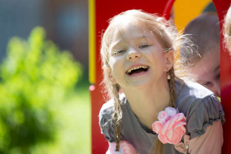 Belarus, the city of Gomil, April 26, 2019. Kindergarten on the street.Cheerful girl from...