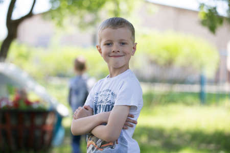 Belarus, the city of Goml, April 26, 2019. Photosession in kindergarten.Portrait of a boy from kindergarten on the street.のeditorial素材