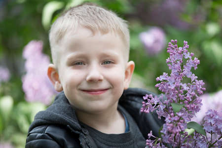 Belarus, the city of Gomel, May 11, 2019. Open day in kindergarten.A child in a lilac. Blond boy...