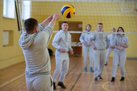 Belarus, the city of Gomil, April 12, 2017.An open lesson in the college of physical education. People play volleyball in the gym.のeditorial素材