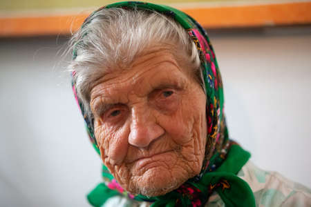 Belarus, the city of Gomil, April 8, 2018. City church. Orthodox Easter.The face is very old grandmother. Woman in a hundred yearsのeditorial素材