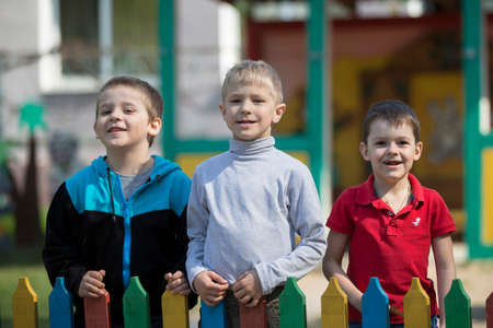 Belarus, the city of Gomil, April 26, 2019. Kindergarten on the street.Three boys from kindergarten for a walk.のeditorial素材