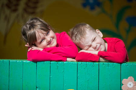 Belarus, the city of Gomil, April 26, 2019. Kindergarten on the street.Cheerful children from kindergarten on a summer walk. Six year old boy and girl play in the garden.のeditorial素材