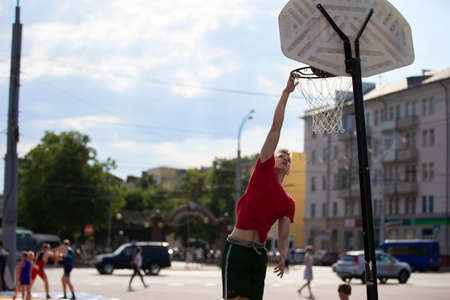 Belarus, the city of Gomel, June 05, 2019. The streets of the town. A man throws a ball into a...