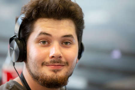 Belarus, the city of Minsk. Programmers Office. Cute guy in Sony headphonesのeditorial素材