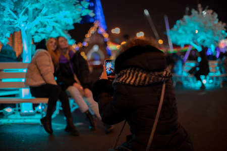 Belarus, the city of Gomil, December 10, 2019. Christmas Fair. People take pictures of the city Christmas square.のeditorial素材