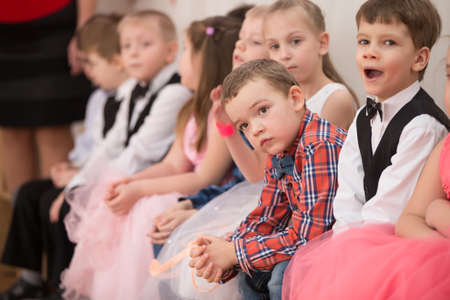 Belarus, Gomel, 6 March 2018. Kindergarten is the fifth. Children's holiday matinee.Sad child on holiday.Bored viewersのeditorial素材