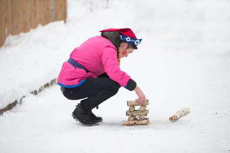 Belarus, Gomel, February 18, 2018. Russian holiday seeing off winter Maslenitsa.National Russian game gorodkiのeditorial素材